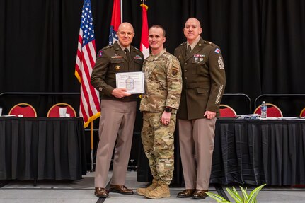 Maj. Gen. Jonathan M. Stubbs, the Adjutant General of the Arkansas National Guard, and Command Sgt. Maj. Gregory White, senior enlisted leader of the Arkansas National Guard presented the Vanguard award to Master Sgt. Greggorey Brewer, at the Enlisted Association of Arkansas National Guard and the National Guard Association of Arkansas (AANG/NGAA) Joint State conference Saturday, Feb. 24 to acknowledge his extraordinary acts of heroism.