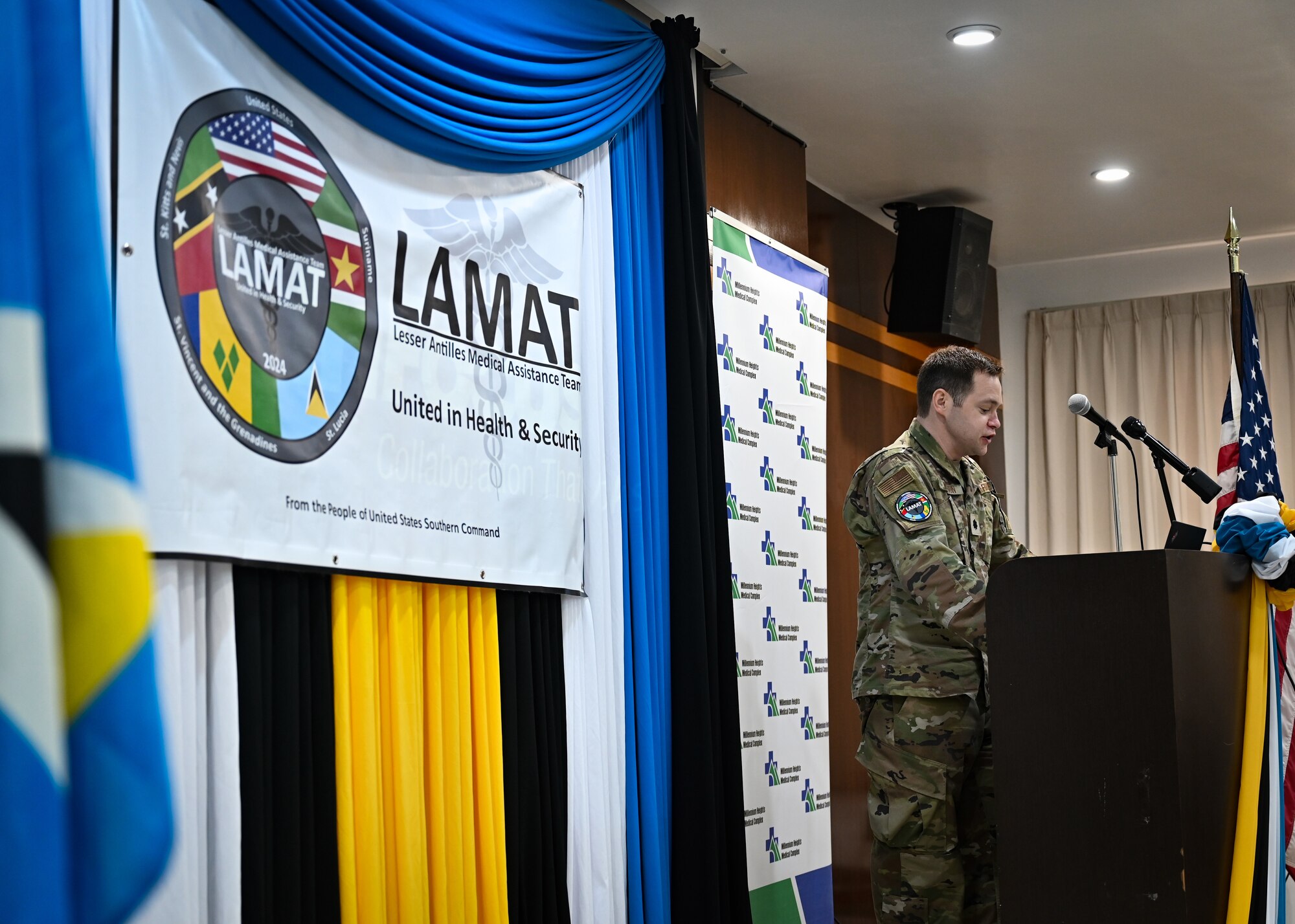 Partner nation medical personnel and U.S. Air Force team members of the St. Lucia Lesser Antilles Medical Assistance Team gather for a group photo during an opening ceremony at Owen King European Union Hospital, Castries, St. Lucia, Feb. 26, 2024.