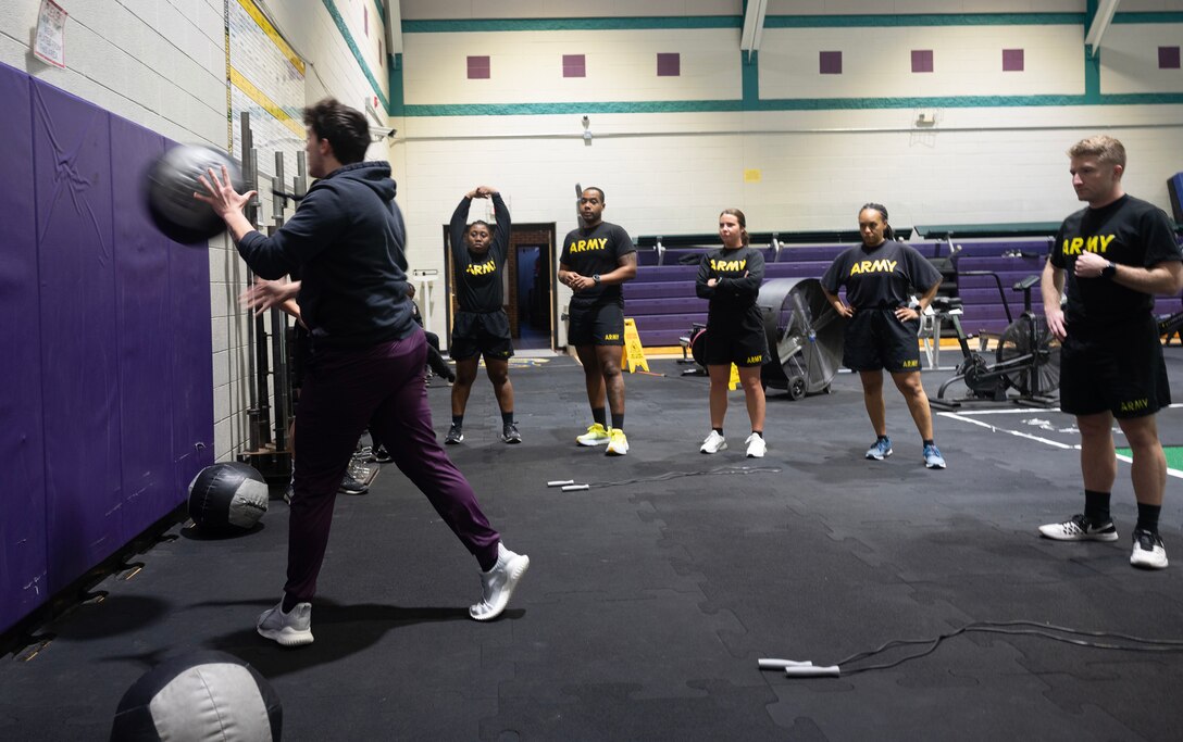 JOINT BASE LANGLEY-EUSTIS, Va. - Master Fitness Trainer Maverick Donnell leads a training session with Soldiers from the 7th Transportation Brigade (Expeditionary) at McClellan Fitness Center, Fort Eustis. Strength and conditioning trainers and a complete Holistic Health and Fitness focused training room are available for interested units local to the area to schedule. (U.S. Air Force photo)