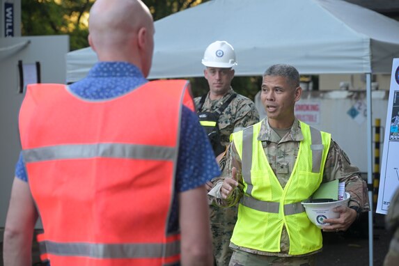 Joint Task Force Red-Hill (JTF-RH) Strategic Engagement Director, U.S. Army Brig. Gen. Lance Okamura, welcomes staff delegation members of U.S. Rep. Ed Case during a tour of the Red Hill Bulk Fuel Storage Facility (RHBFSF) Feb. 22, 2024, at Halawa, Hawaii.