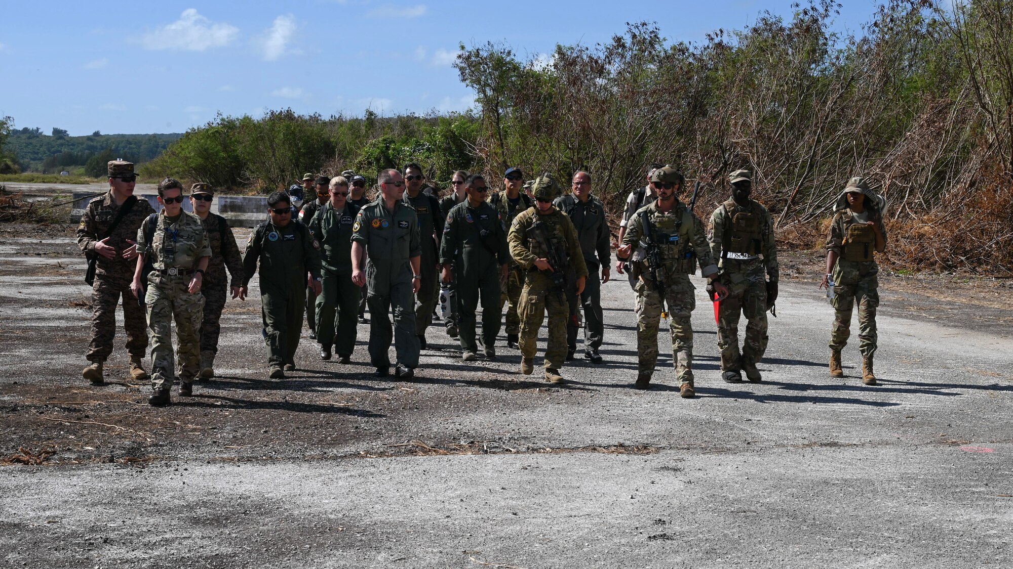 Military members from several countries walk to the Bakker Camp.