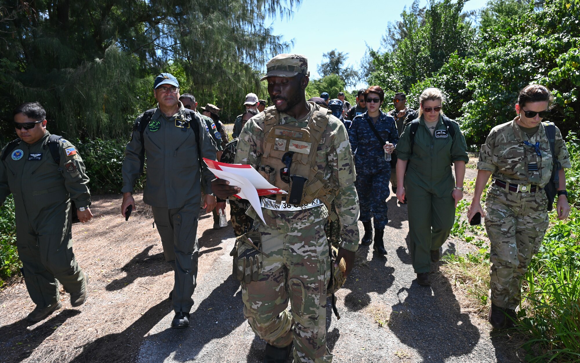 An Airman provides a tour while also explaining historical facts about the island of Tinian to the military members from several countries.