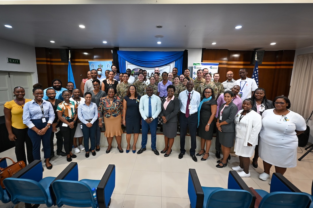 Partner nation medical personnel and U.S. Air Force team members of the St. Lucia Lesser Antilles Medical Assistance Team gather for a group photo during an opening ceremony at Owen King European Union Hospital, Castries, St. Lucia, Feb. 26, 2024.