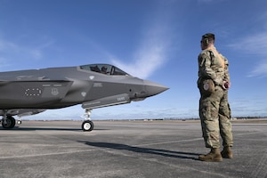 U.S. Air Force Staff Sgt. Christian Fischer, a tactical aircraft maintenance specialist with the Wisconsin Air National Guard's 115th Fighter Wing, assists an F-35A Lightning II pilot with preflight tasks February 13, 2024, during a Weapon System Evaluation Program exercise at Tyndall Air force Base, Florida.