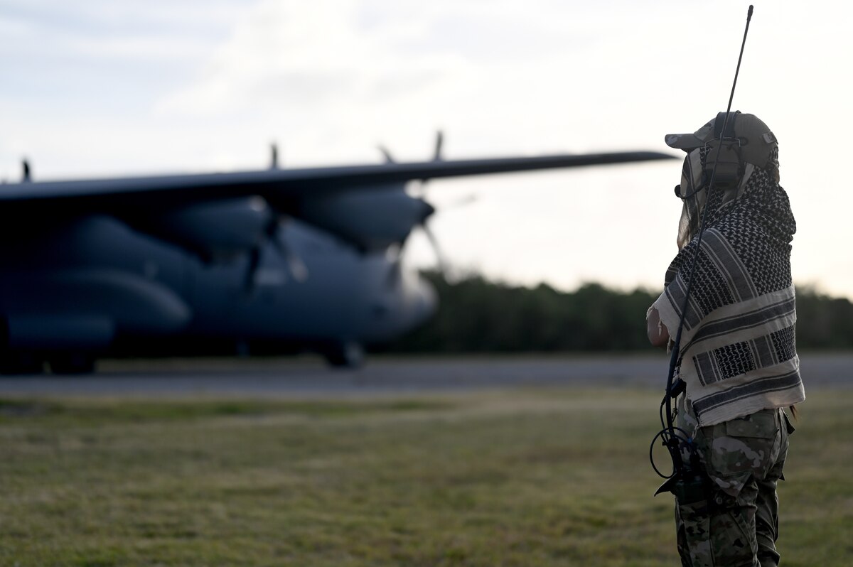 A 736th Contingency Response Squadron air traffic controller manages an impromptu airfield during Cope North at Tinian, Northern Mariana Islands, Feb. 11, 2024. Large-scale, multinational exercises in the Indo-Pacific Region act as a force multiplier in the region, building a more integrated and lethal force together. (U.S. Air Force photo by Staff Sgt. Gerald R. Willis)