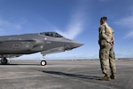 U.S. Air Force Staff Sgt. Christian Fischer, a tactical aircraft maintenance specialist with the Wisconsin Air National Guard's 115th Fighter Wing, assists an F-35A Lightning II pilot with preflight tasks February 13, 2024, during a Weapon System Evaluation Program exercise at Tyndall Air force Base, Florida.