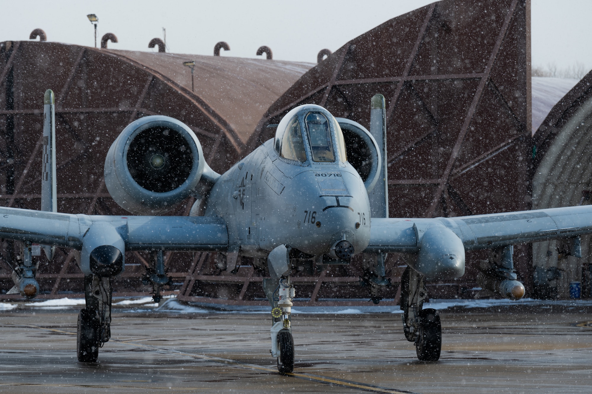 A U.S. Air Force A-10C Thunderbolt II from the 25th Fighter Squadron prepares to taxi to the runway at Osan Air Base, Republic of Korea, Jan. 22, 2024. Crew chiefs prevent accidents and collisions from occurring by signaling to the pilot when and where to move the aircraft prior to taxi. (U.S. Air Force photo by Airman 1st Class Chase Verzaal)