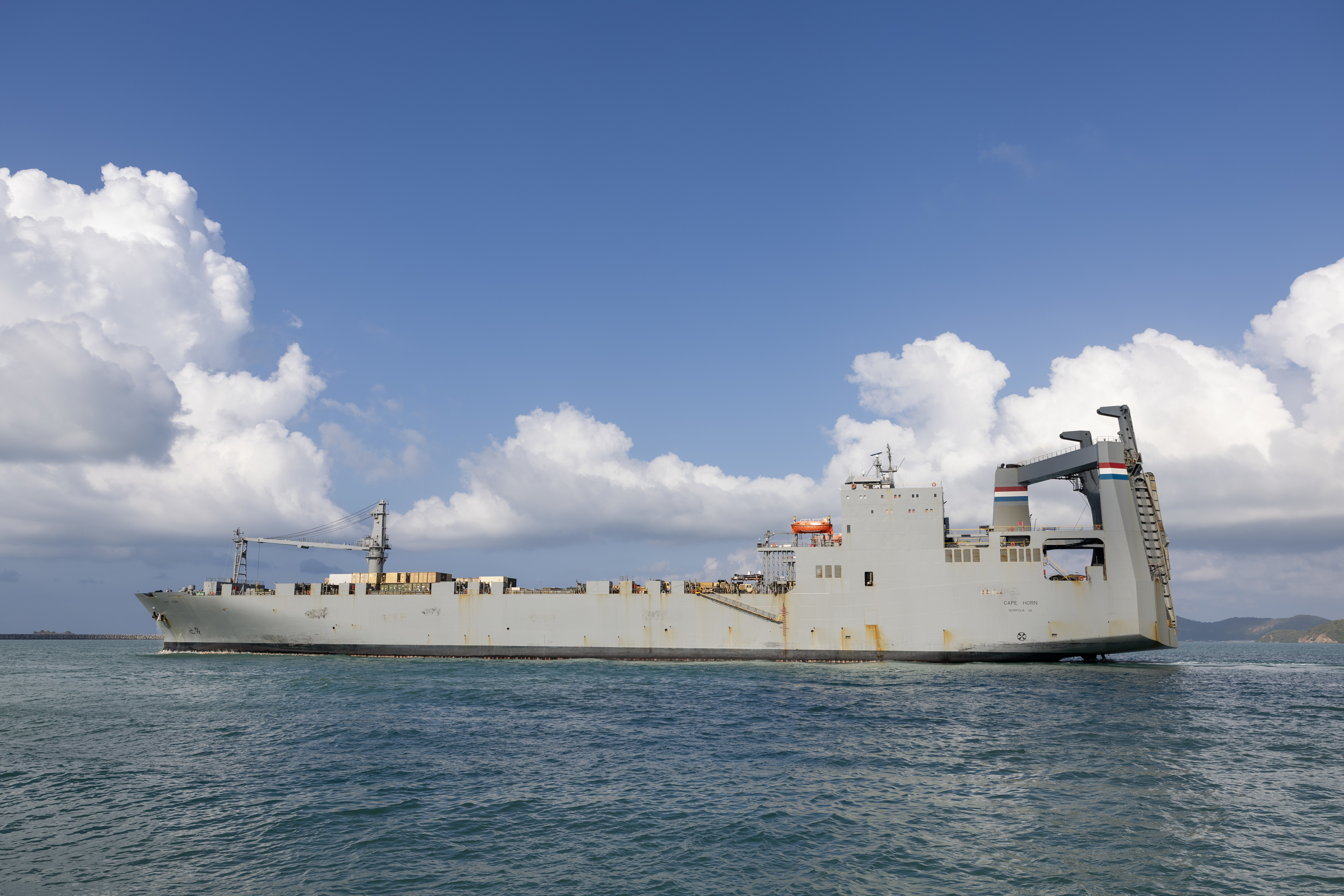 Military Sealift Command (MSC) chartered ship MV Cape Horn (T-AKR 5068) departs the port of Sattahip, Thailand, after discharging about 260 end items for exercise Cobra Gold 2024, Feb. 22. CG24 is the 43rd iteration of the Joint Cobra Gold series of exercises. CG24 emphasizes coordination on readiness, civic action, humanitarian assistance and disaster relief, and seeks to expand regional cooperation and collaboration in these vital areas. MSC directs and supports operations for approximately 140 civilian-crewed ships that replenish U.S. Navy ships at sea, conduct specialized missions, preposition combat cargo at sea around the world, perform a variety of support services, and move military equipment and supplies to deployed U.S. forces. (Photo by Grady T. Fontana)