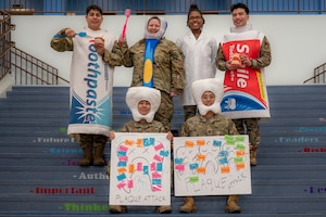 U.S. Airmen assigned to the 51st Medical Group dental clinic pose for a photo at Osan Air Base, Republic of Korea, Feb. 23, 2024. The Airmen visited Osan Elementary School for National Children’s Dental Health Month. Their goal was to spread awareness about the importance of dental hygiene to children. (U.S. Air Force photo by Senior Airman Brittany Russell)