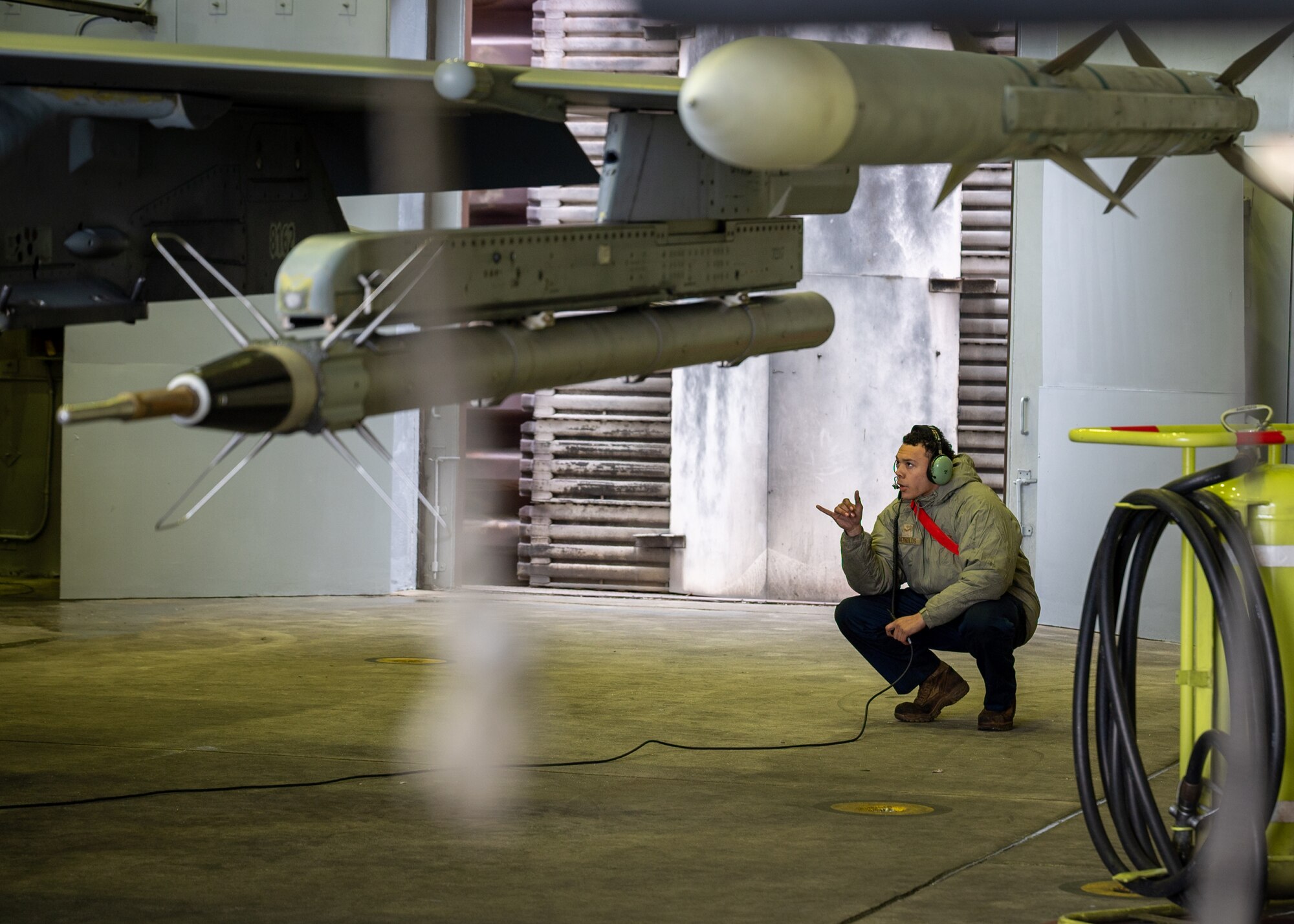Crew chief performs pre-flight checks.