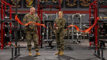 U.S. Marine Corps Brig. Gen. Michael E. McWilliams, left, commanding general, 2nd Marine Logistics Group, and Lt. Colleen Cronin, director of the Human Performance Center, cut a ceremonial ribbon during the grand opening of the Human Performance Center on Camp Lejeune, North Carolina, Feb. 15, 2024. 2nd MLG invested in a Human Performance Center focused on integrating all domains of Marine Corps Total Fitness and optimizing human performance. (U.S. Marine Corps photo by Lance Cpl. Jessica J. Mazzamuto)