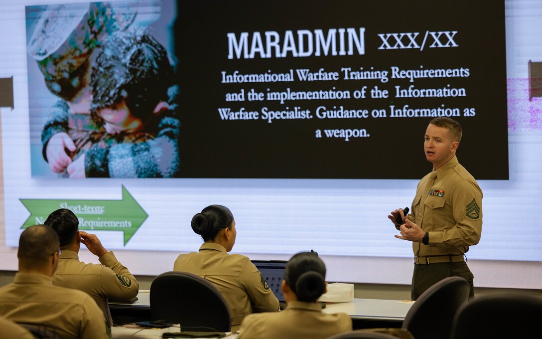 U.S. Marine Corps Staff Sgt. Alex Robertson, security force training instructor with Marine Corps Security Force Regiment, gives a presentation during the Career School at the Staff Non-Commissioned Officer Academy on Marine Corps Base Quantico, Virginia, Feb. 23, 2024. The SNCO Academy educates and develops enlisted Marines to be ethical, moral and professional leaders capable of making sound decisions even in times of ambiguity. (U.S. Marine Corps Photo by Sgt. Mitchell Johnson)