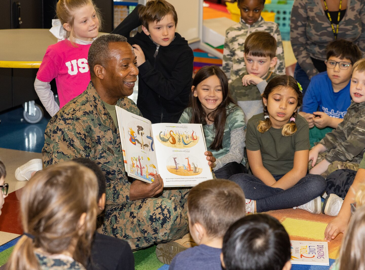 U.S. Marine Corps Col. Michael L. Brooks, commanding officer of Marine Corps Base Quantico, reads to second grade students to celebrate Read Across America Day at Crossroads Elementary School on MCB Quantico, Virginia, Feb. 26, 2023. The event is observed to encourage literacy and reading among children and teenagers, and is celebrated annually near or on Dr. Seuss’ birthday. (U.S. Marine Corps Photo by Lance Cpl. Kayla LeClaire)