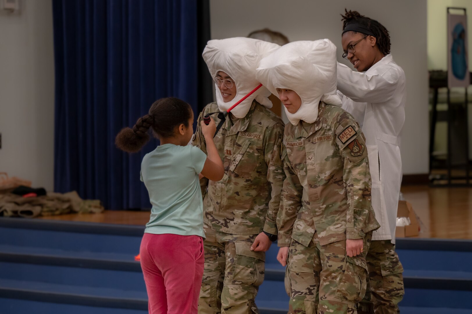 U.S. Airmen assigned to the 51st Medical Group dental clinic participate in games with Osan Elementary School students at Osan Air Base, Republic of Korea, Feb. 23, 2024. Airmen visited the school to spread awareness about National Children’s Dental Health Month. They aimed to communicate the importance of dental hygiene while making it a fun and interactive experience for the children. (U.S. Air Force photo by Senior Airman Brittany Russell)