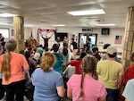 A group of Soldiers lead activities for a crowd of 4-H members.