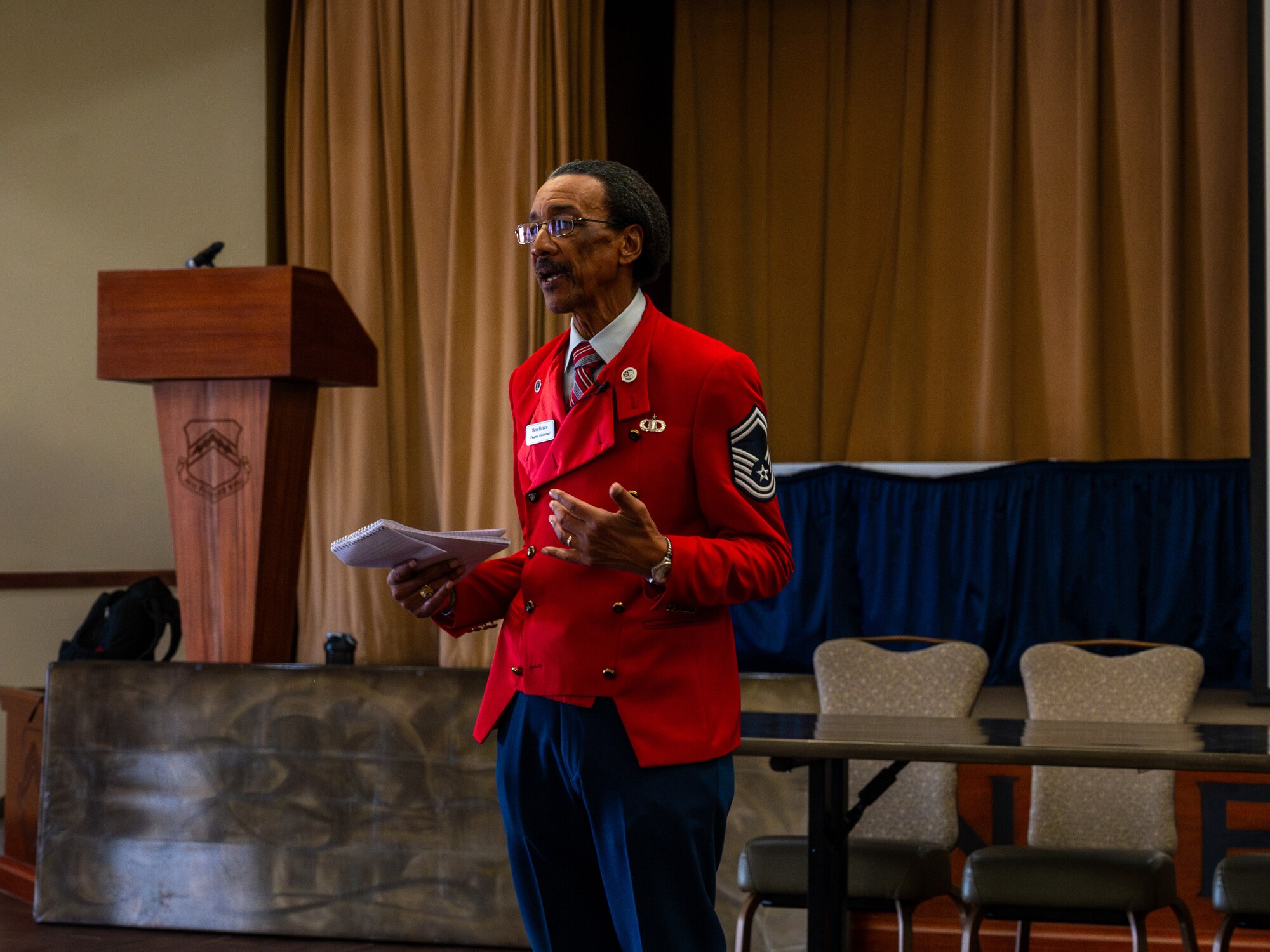 Ben Bruce, Ragsdale Arizona Tuskegee Airmen chapter historian, speaks with Airmen during the Black History Month event, Feb. 23, 2024, at Luke Air Force Base, Arizona.