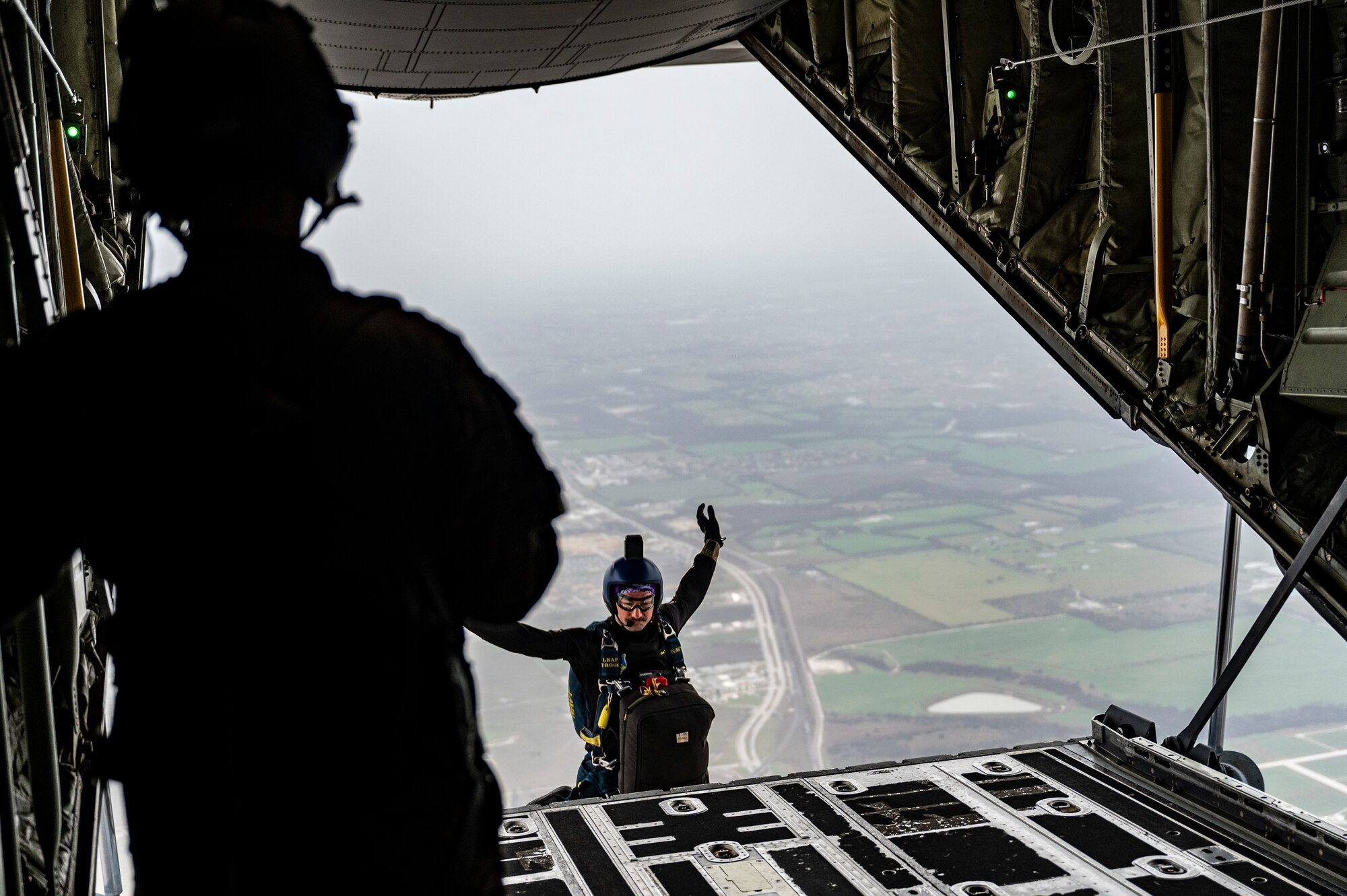 A U.S. Navy Parachute Team member completes a demonstration in Texas, Feb. 10, 2023. The 317th Airlift Wing provided airlift support to the team, completing key training objectives and demonstrating joint interoperability. The Navy Parachute Team began in 1969 when Navy SEALs and Underwater Demolition Team (UDT) members volunteered at weekend air shows. The team was officially commissioned the Leap Frogs in 1974 by the Chief of Naval Operations with the mission to demonstrate Navy excellence throughout the United States. (U.S. Air Force photo by Airman 1st Class Emma Anderson)