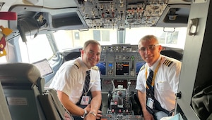 Col. Marc McAllister, left, and Col. James Mach in the cockpit of a United Airlines aircraft. Mach was McAllister's boss and mentor while both served at the 927th Air Refueling Wing at MacDill Air Force Base, Florida, McAllister is Mach's mentor at United. (Courtesy photo)