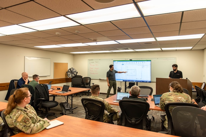 Members participating in a classroom setting.