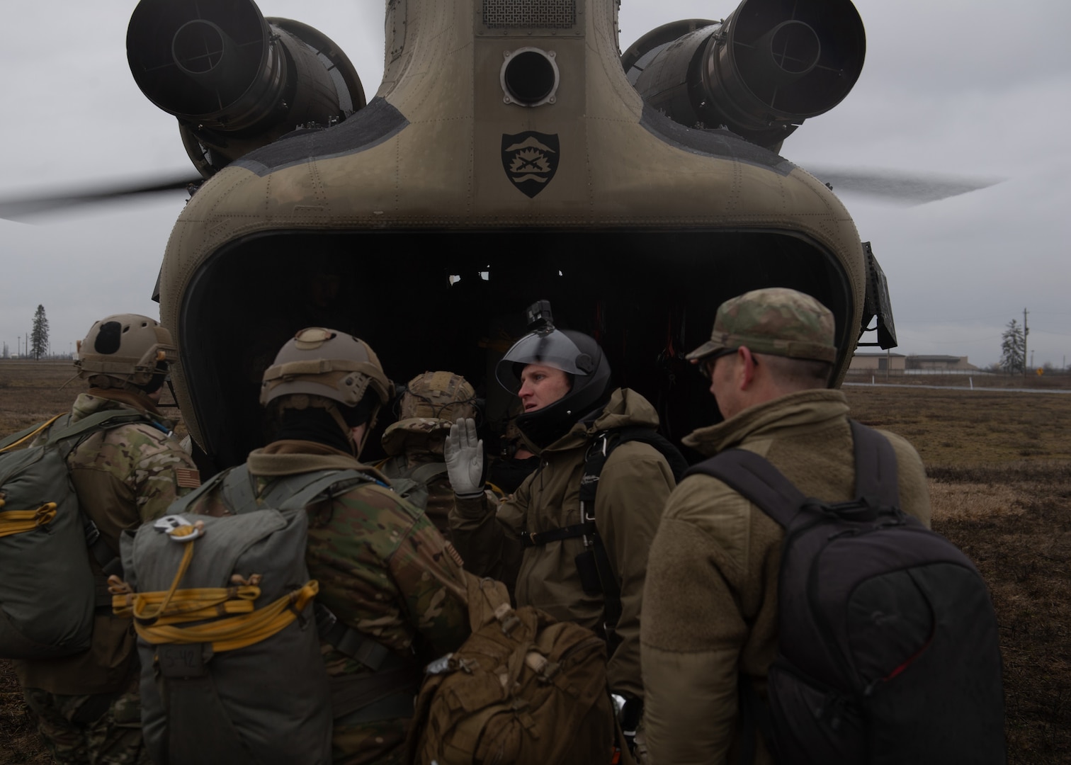 Members of the 116th Air Support Operations Squadron load onto a CH-47 Chinook at Fairchild Air Force Base, Spokane, Wash., Feb. 5, 2024.