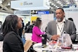 Army Medical Logistics Command Human Resources Director Kenneth Daniels discusses career opportunities with a potential candidate at BEYA on Feb. 17 in Baltimore, Maryland. BEYA is an annual event that attracts thousands of nationwide job seekers -- both in person and virtually -- to a two-day showcase of career opportunities, primarily in the STEM fields of science, technology, engineering and math.