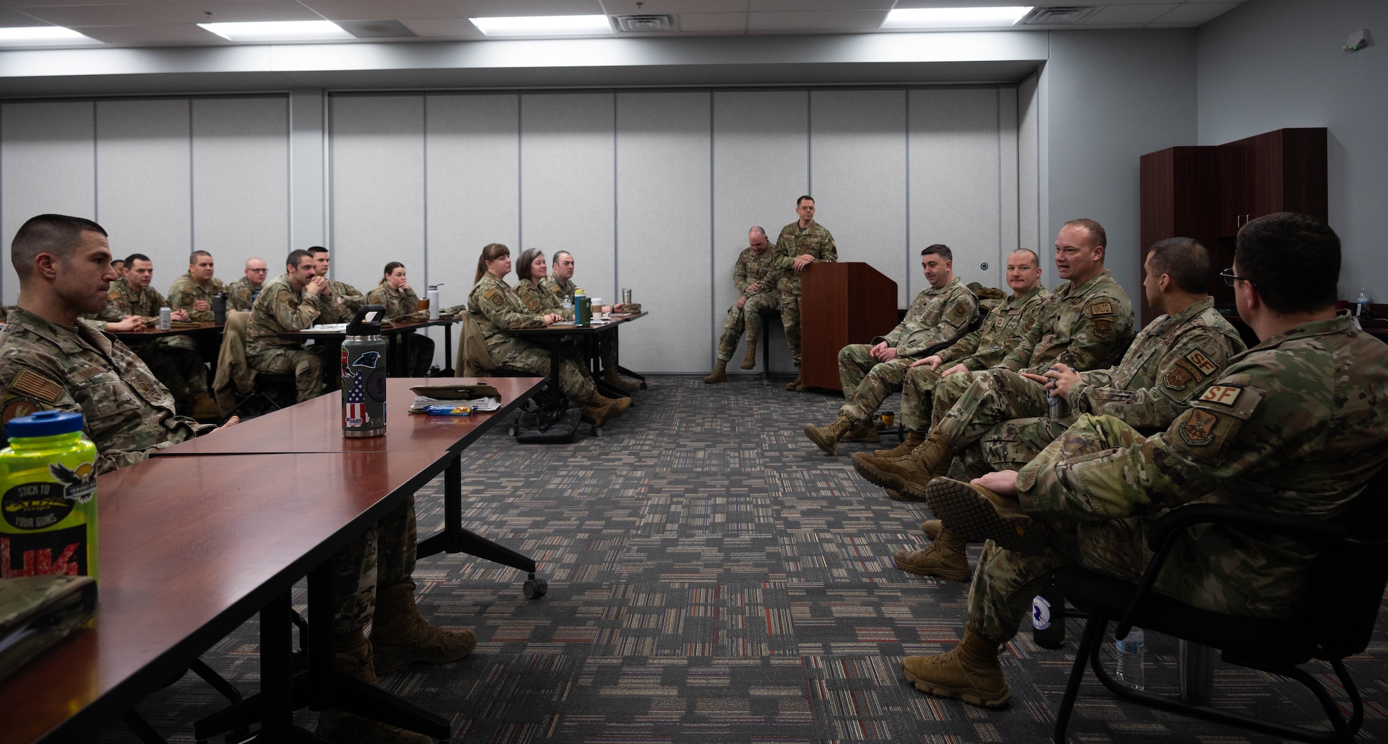 Team Minot commanders give remarks during the First Sergeant Symposium at Minot Air Force Base, North Dakota, Feb. 23, 2024. The commander and chief panel was held to give Minot Airmen stepping into the role of a first sergeant an idea of what their leadership expects from them. (U.S. Air Force photo by Airman 1st Class Luis Gomez)
