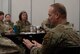 U.S. Air Force Lt. Col. Stephen Kroft, 5th Contracting Squadron commander, responds to questions at the First Sergeant Symposium at Minot Air Force Base, North Dakota, Feb. 23, 2024. The commander and chief panel was held to give Minot Airmen stepping into the role of a first sergeant an idea of what their leadership expects from them. (U.S. Air Force photo by Airman 1st Class Luis Gomez)