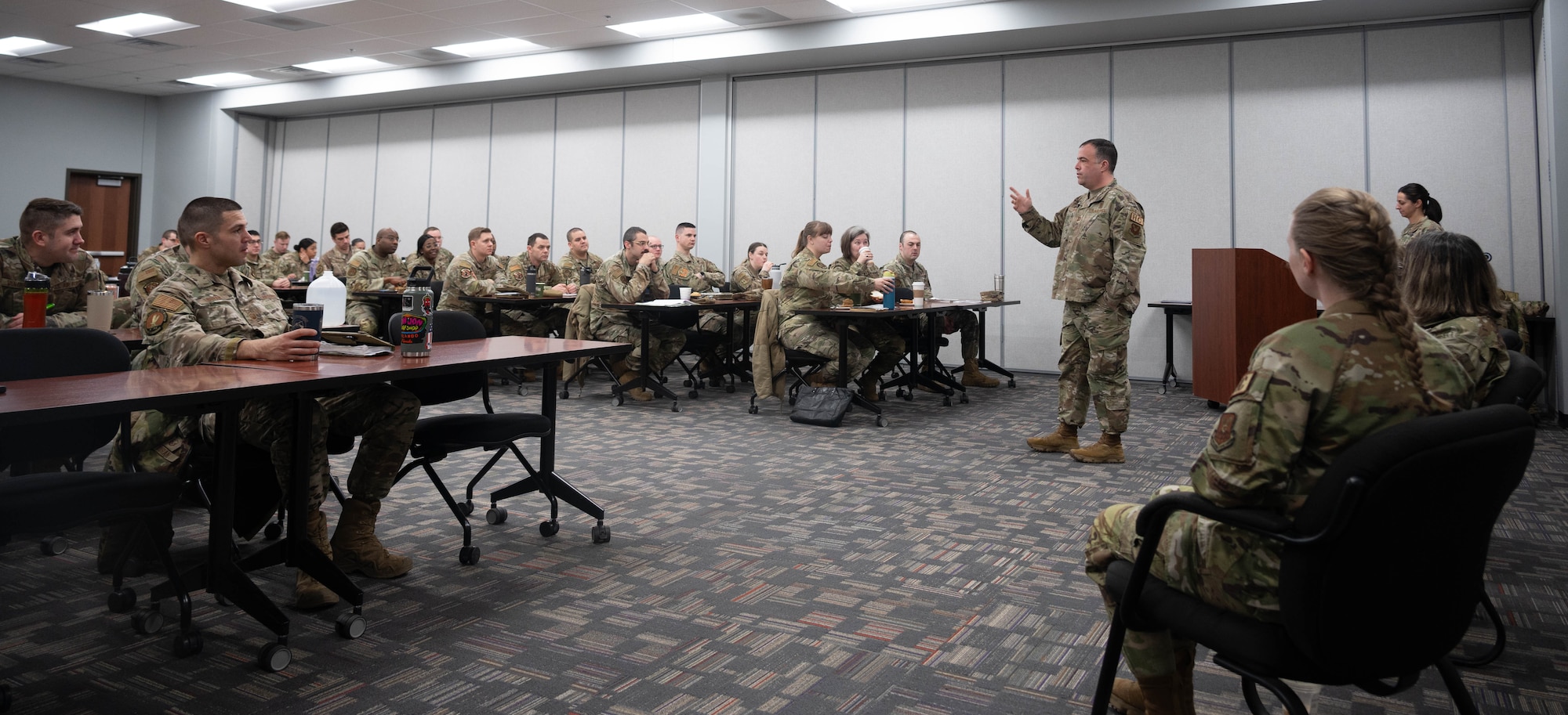 U.S. Air Force Capt. Jared Parker, 5th Bomb Wing chaplain, answers questions during the First Sergeant Symposium at Minot Air Force Base, North Dakota, Feb. 23, 2024. The chaplain breakfast and panel reinforced the importance of the relationship between first sergeants and the Chaplain Corps.