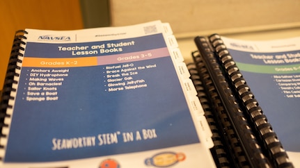 Copies of STEM lesson plans are laid out for DoD STEM Ambassadors in West Bethesda, Md., on Feb. 22, 2024.