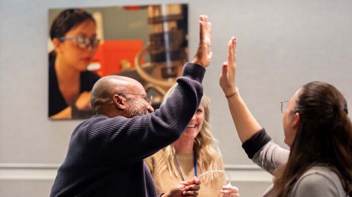 A DoD STEM Ambassador receives praise from Carderock’s STEM and Outreach Coordinator Charlotte George in West Bethesda, Md., on Feb. 22, 2024.