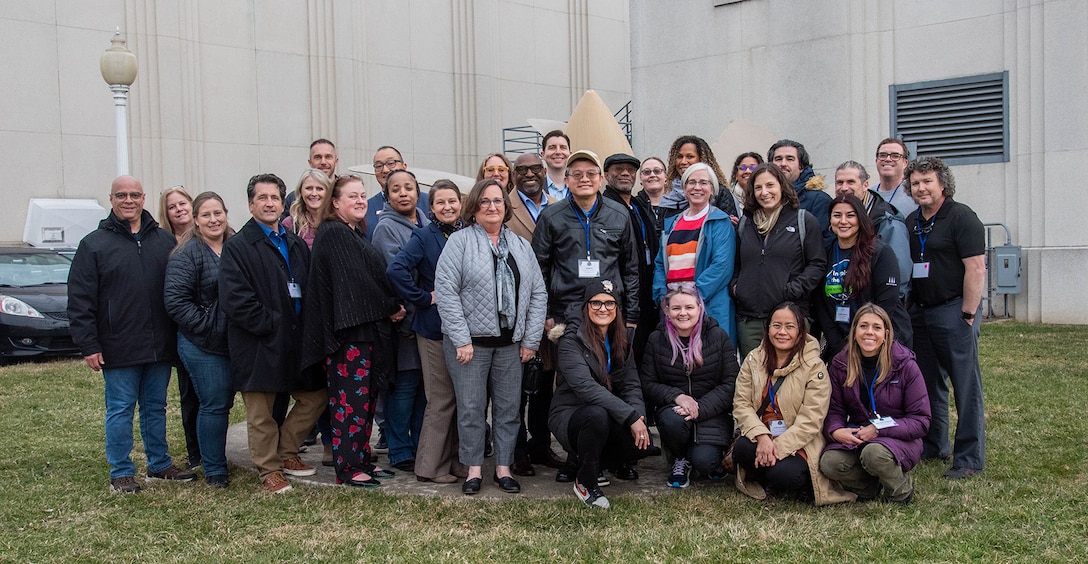 Department of Defense STEM Ambassadors stand together for a group photo outside the David Taylor Model Basin (DTMB) in West Bethesda, Md., on Feb. 22, 2024.