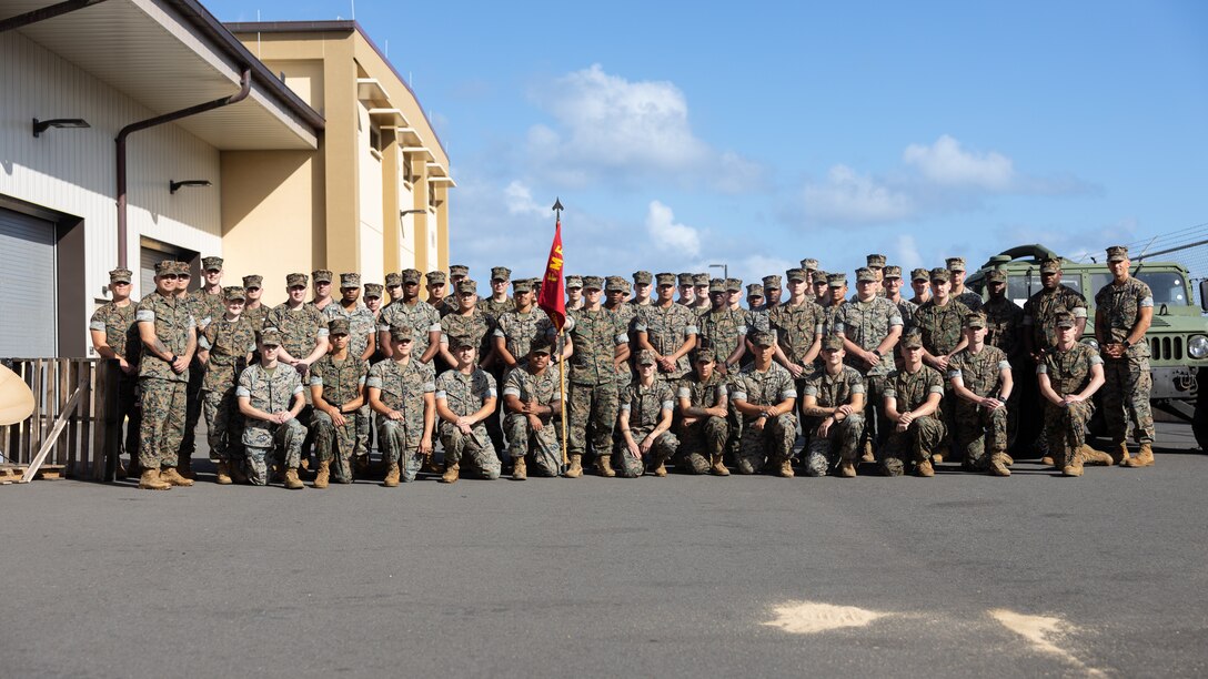 U.S. Marines with 3d Marine Littoral Regiment, 3d Marine Division pose for a group photograph on Marine Corps Base Hawaii, Feb. 26, 2024. The Marines were celebrating Communications Company, 3d MLR winning the 2023 Lieutenant Colonel Kevin M. Shea Memorial Unit of the Year Award. (U.S. Marine Corps photo by Sgt. Jacqueline C. Parsons)