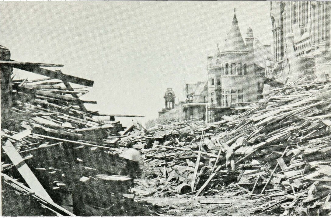 This historical photograph shows the aftermath of the Galveston Hurricane of 1900 from 13th Street and Broadway. 

The Great Storm of 1900 pummeled a defenseless island coastline with a 15 ft. tide and winds that reached an estimated 120 mph. In the aftermath, roughly 8,000 lives were lost and the remains of more than 3,600 homes lay scattered along the city. To date, it is the deadliest natural disaster in U.S. history.