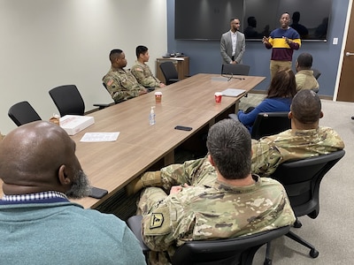 James O. Parker IV, the new Virginia Army National Guard director of psychological health, is introduced to members of the VAARNG community by Jonathan Goldwire, the previous DPH, Feb. 15, 2024, in Richmond, Virginia.