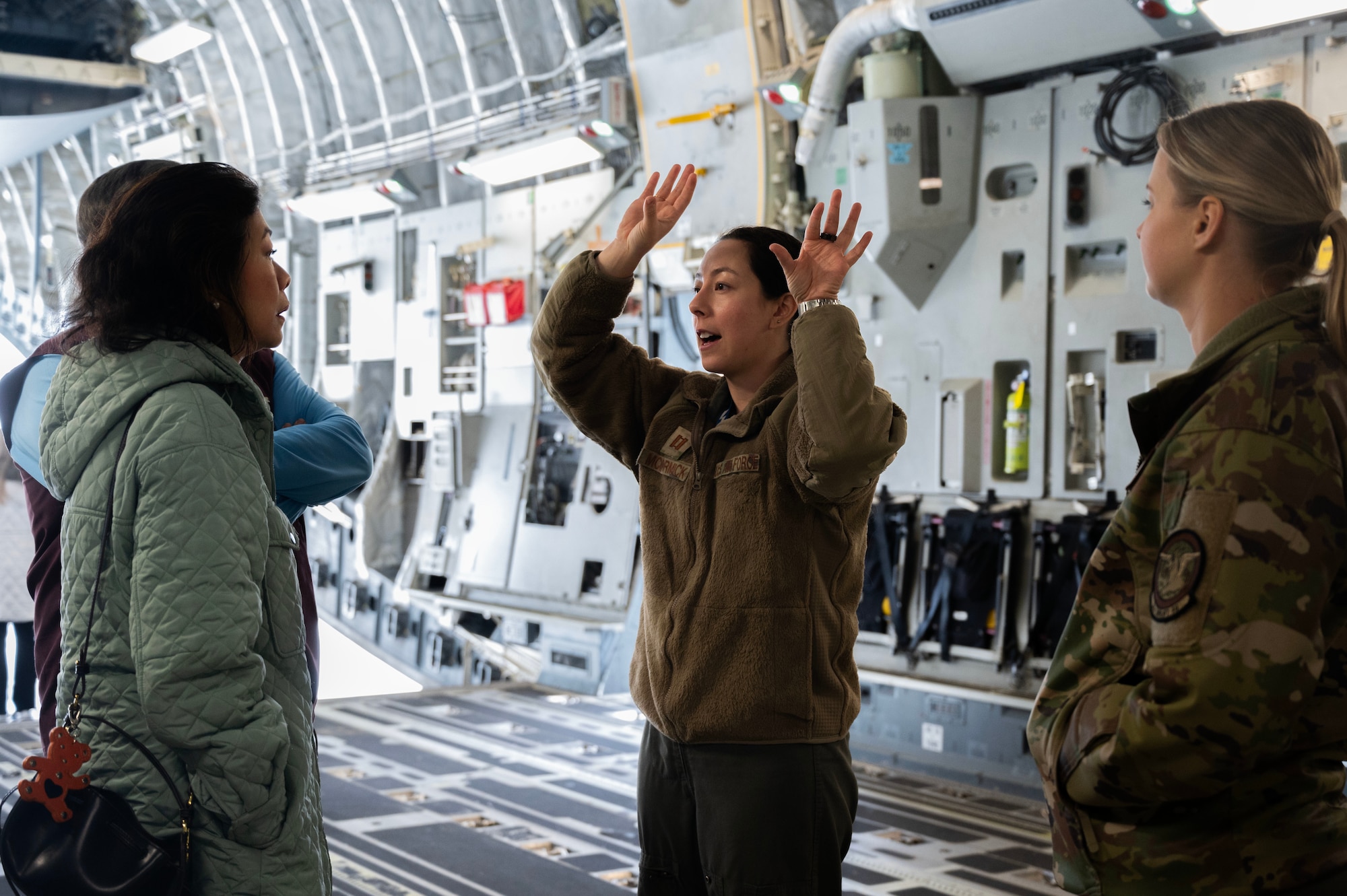 University of Washington ROTC cadets pose for a picture before takeoff in a C-17 Globemaster III at Joint Base Lewis-McChord, Washington, Feb. 23, 2024. Team McChord opened its doors to the cadets, so they could have the opportunity to better understand the McChord mission and see how each Airman contributes to it. (U.S. Air Force photo by Airman 1st Class Kylee Tyus)