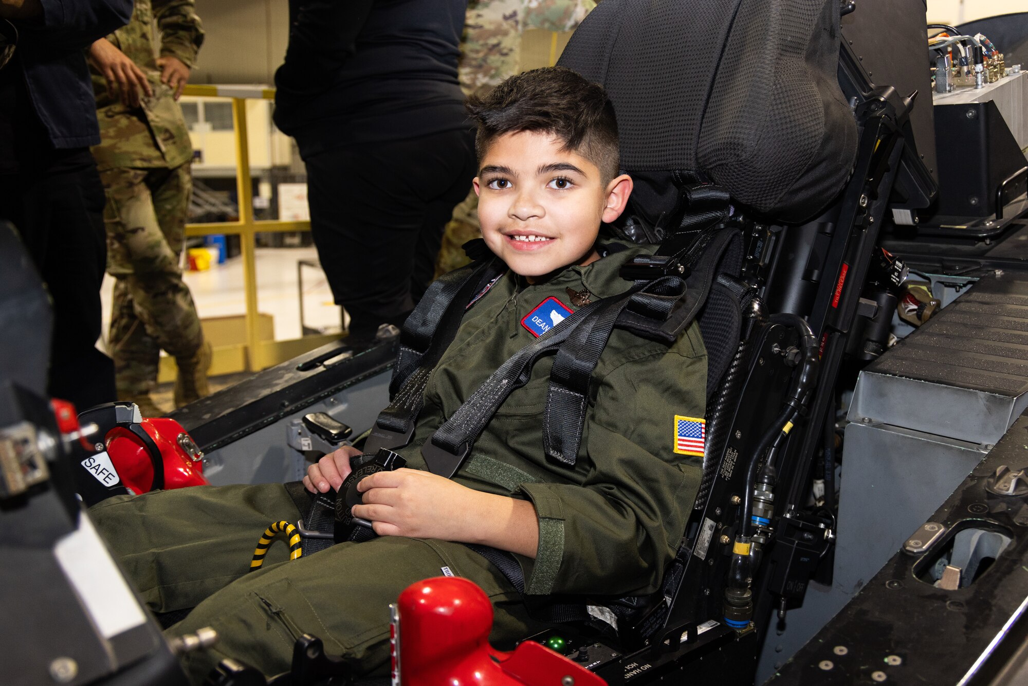 Nine-year-old Dean Lomelin, sits inside the cockpit of an F-35 Lightning II, Jan. 31, 2024, during his visit to Edwards Air Force Base, California, as part of the 412th Test Wing's Wing-a-Wish. (Air Force photo by Kaitlyn Steigerwald)