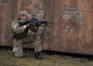 A member of the 116th Air Support Operations Squadron holds their position with a simunition modified M4 during training at Fairchild Air Force Base, Spokane, Wash., Feb. 6, 2024.