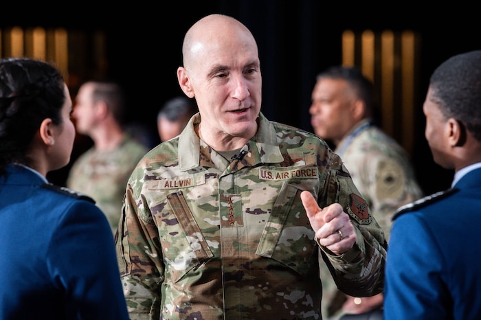 Cadet 1st Class Ruben Banks speaks with Chief Master Sgt. Of the Space Force John Bentivegna