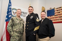 The Navy's N13 Director, Rear Adm. Jim Waters, Master Chief Robotics Warfare Specialist Chris Rambert and the Chief of Naval Personnel, Vice Adm. Rick Cheeseman, pose for a photo in the N13 office