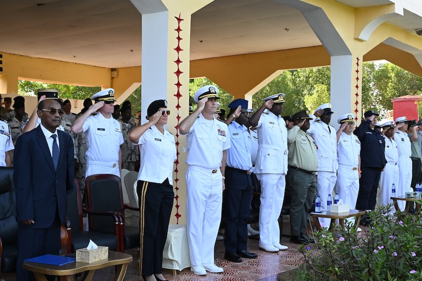Adm. Eric Anduze salutes during the opening ceremony of Cutlass Express.