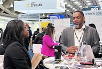 Army Medical Logistics Command Human Resources Director Kenneth Daniels discusses career opportunities with a potential candidate at BEYA on Feb. 17 in Baltimore, Maryland. BEYA is an annual event that attracts thousands of nationwide job seekers -- both in person and virtually -- to a two-day showcase of career opportunities, primarily in the STEM fields of science, technology, engineering and math.