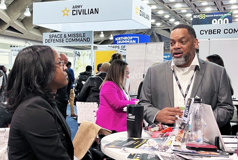 Army Medical Logistics Command Human Resources Director Kenneth Daniels discusses career opportunities with a potential candidate at BEYA on Feb. 17 in Baltimore, Maryland. BEYA is an annual event that attracts thousands of nationwide job seekers -- both in person and virtually -- to a two-day showcase of career opportunities, primarily in the STEM fields of science, technology, engineering and math.