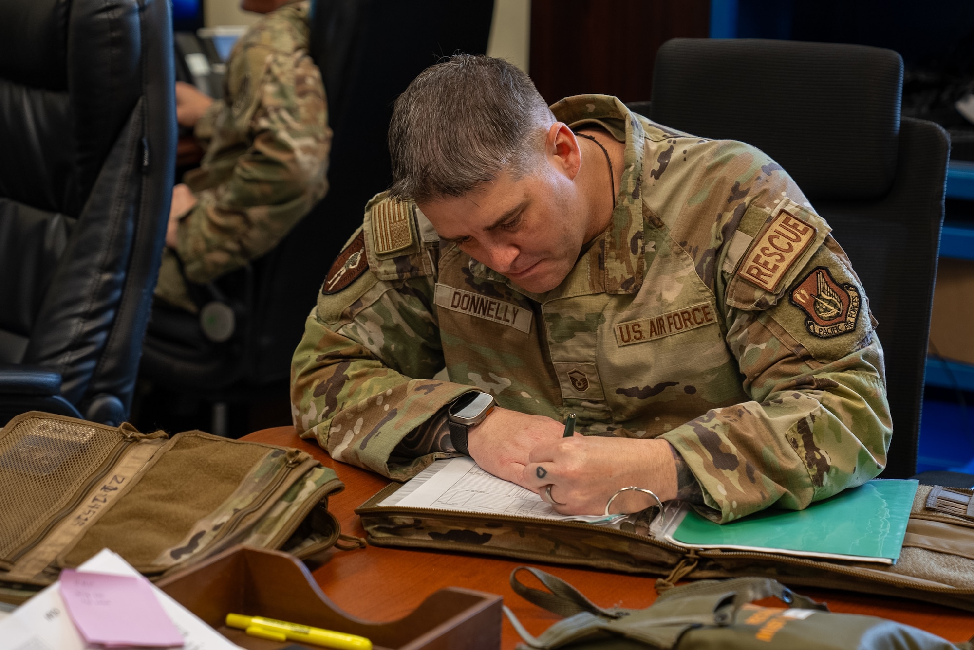 U.S. Air Force Master Sgt. signing an exceptional release for the HH-60W