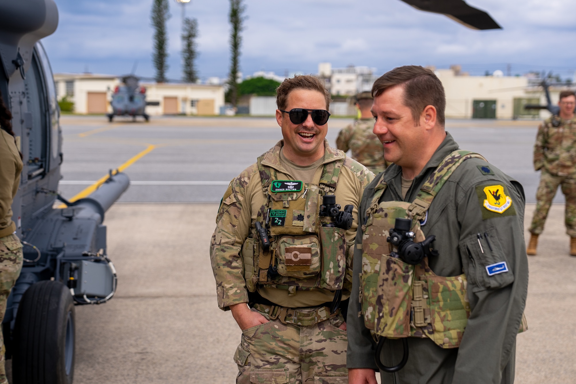 Two HH-60W pilots stepping towards their aircraft