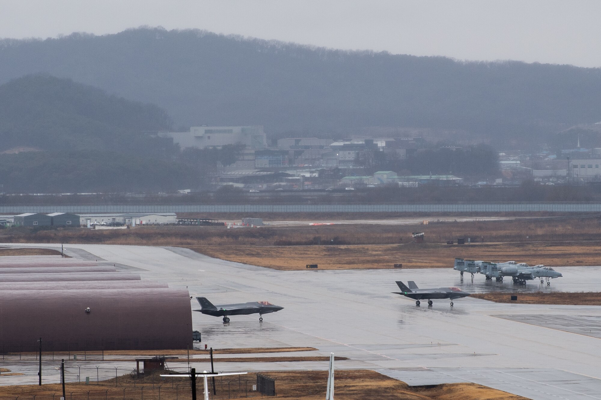 Two U.S. Air Force F-35A Lightning II aircraft taxi to the runway at Osan Air Base, Republic of Korea, Feb. 21, 2024.