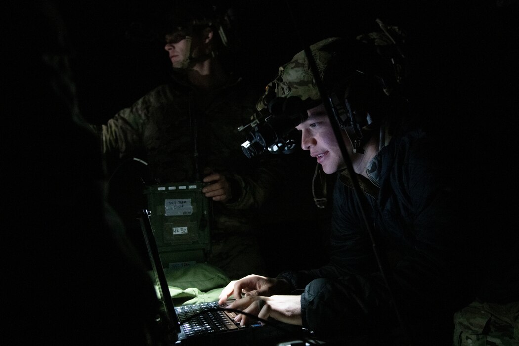 Airman uses battle management tool at night