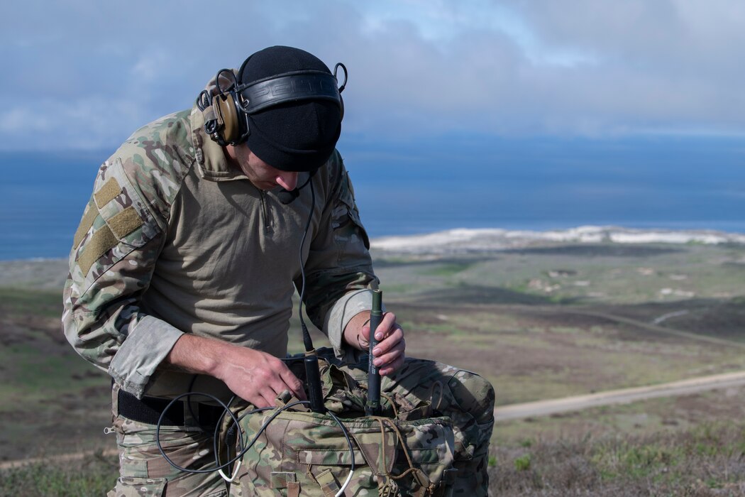 Airman sets up a radio antenna