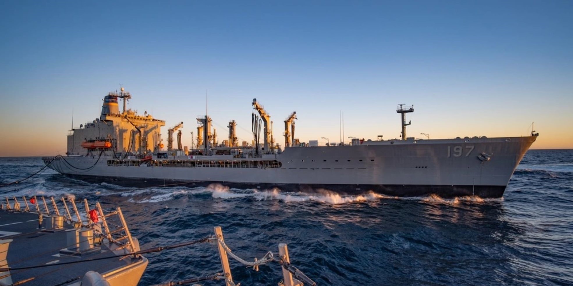 USS Russell (DDG 59) breaks away from USNS Pecos after refueling