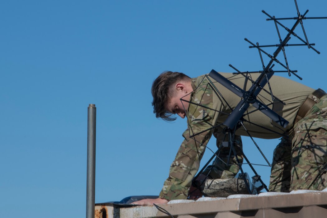 Airman sets up antenna