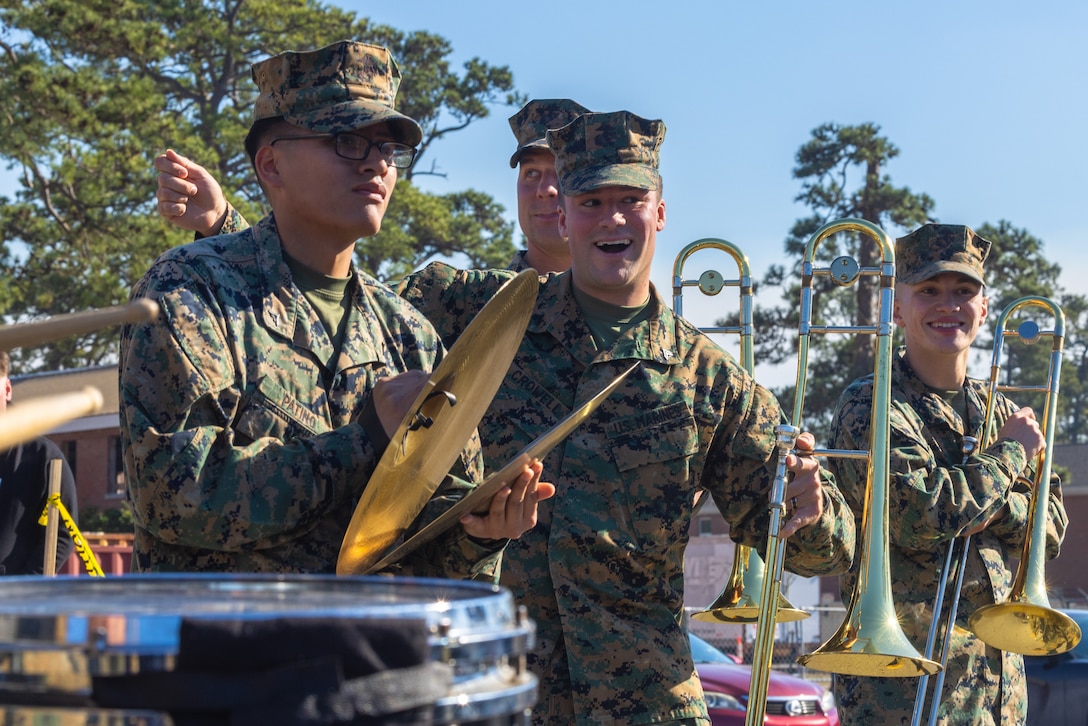 U.S. Marines with the 2d Marine Division Band perform while participating in a parade during a Mardis Gras celebration on Camp Lejeune, North Carolina, Feb. 21, 2024. The 10th Marine Regiment participated in the first Mardi Gras parade on Camp Lejeune to help build a sense of community between Marines and their families. (U.S. Marine Corps photo by Lance Cpl. Daysia McCree)